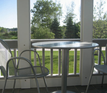 11. a bistro table on the screened porch